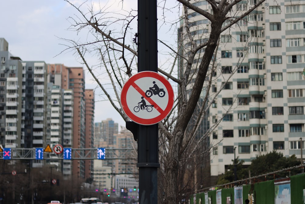 a no bicycle allowed sign on a street pole