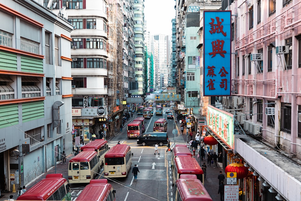 a city street filled with lots of traffic and tall buildings