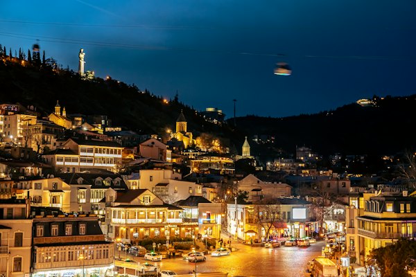 A view of a city at night from the top of a hill — Tbilisi, Georgia