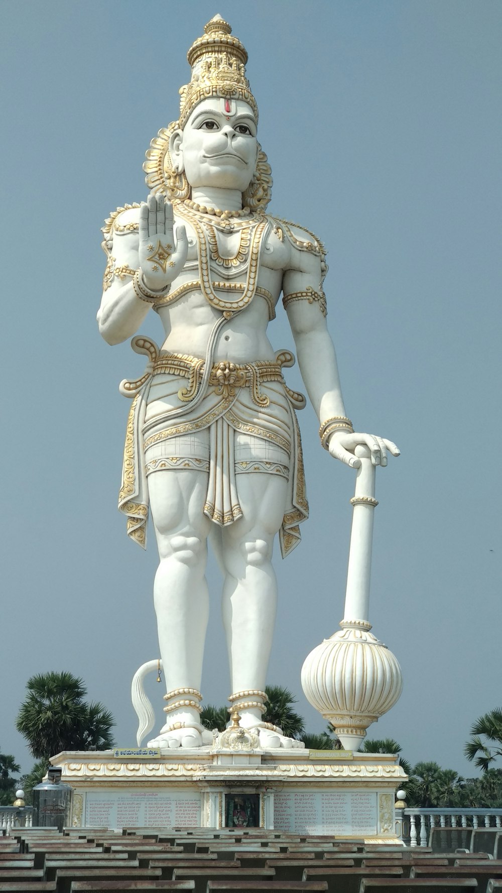 a large statue of a man holding a cane