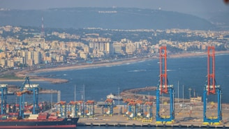 a large body of water with a city in the background