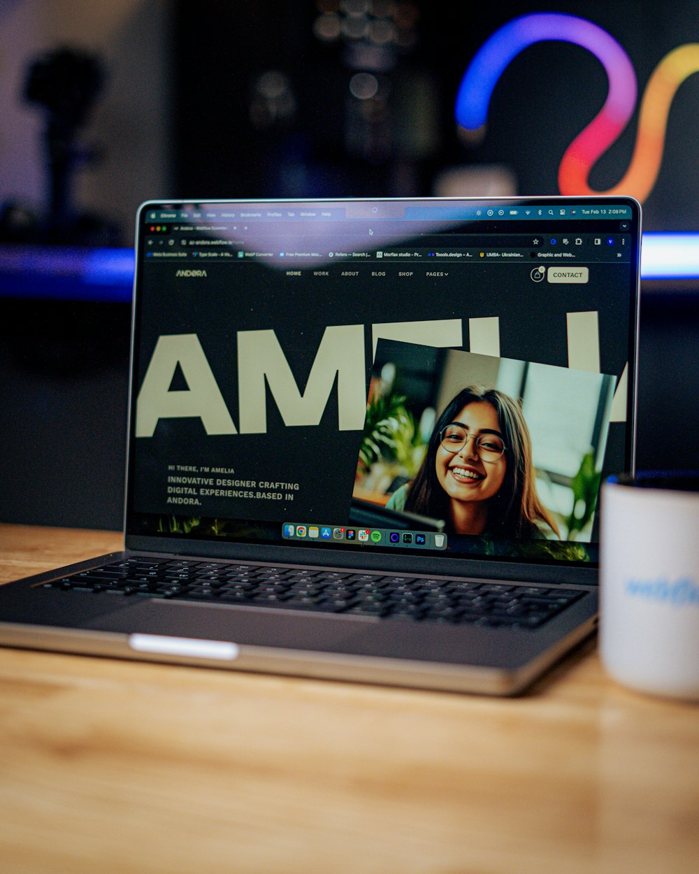 a laptop computer sitting on top of a wooden table