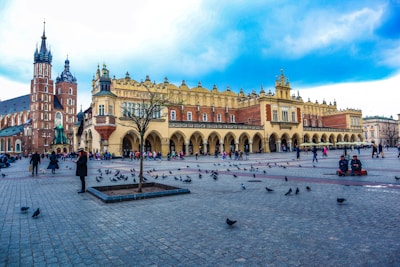 a large building with a lot of birds around it
