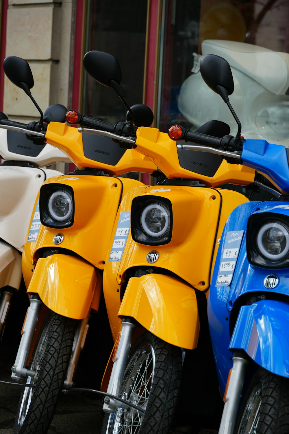 a row of motorcycles parked next to each other