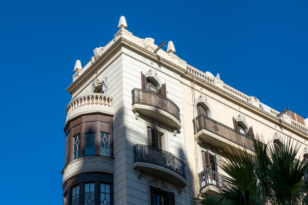 a tall building with balconies and balconies on the top of it