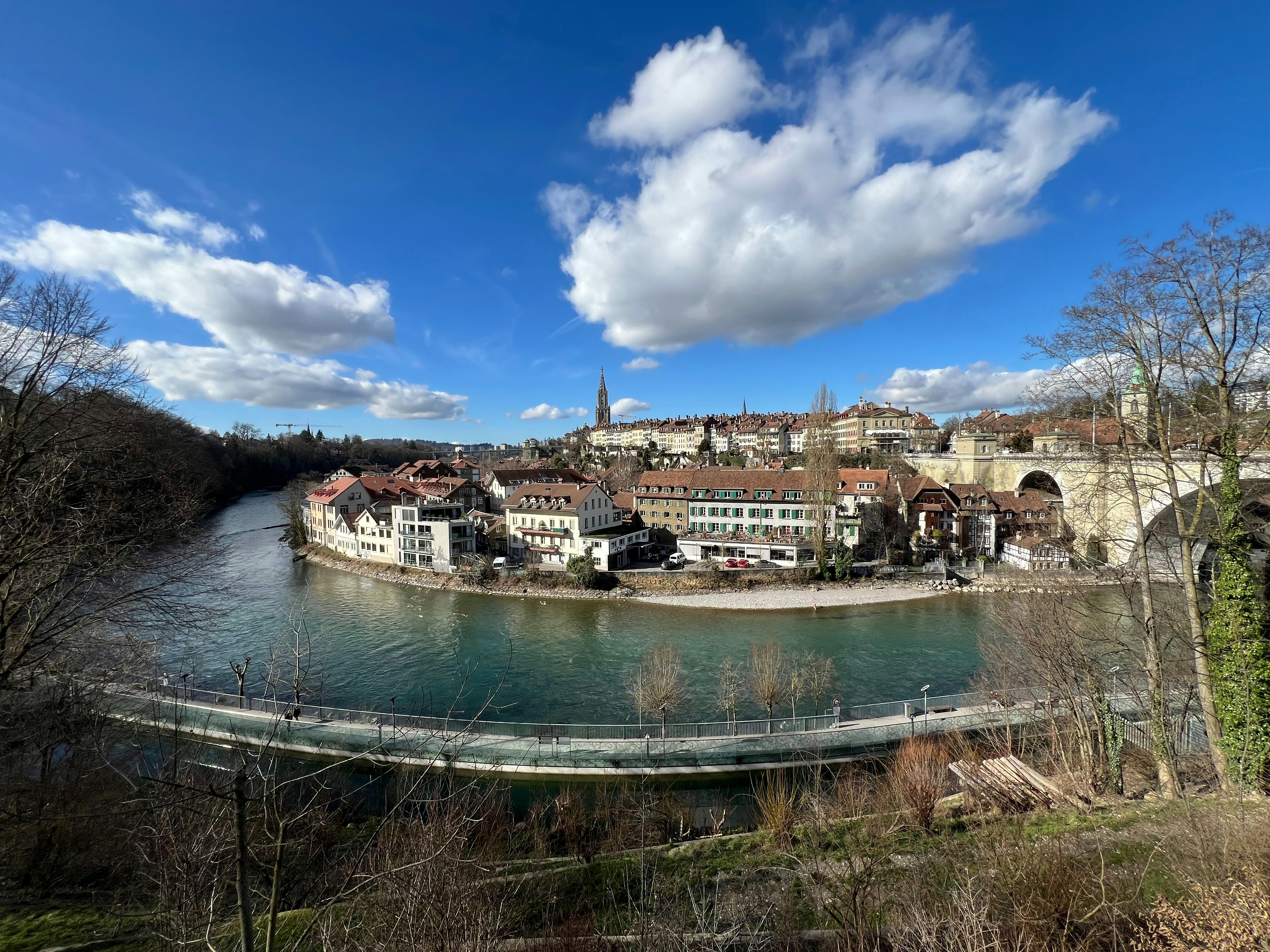 a river running through a city next to a bridge