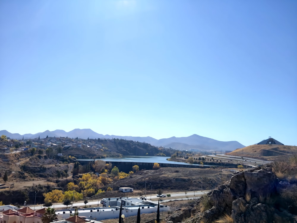 a scenic view of a river and mountains