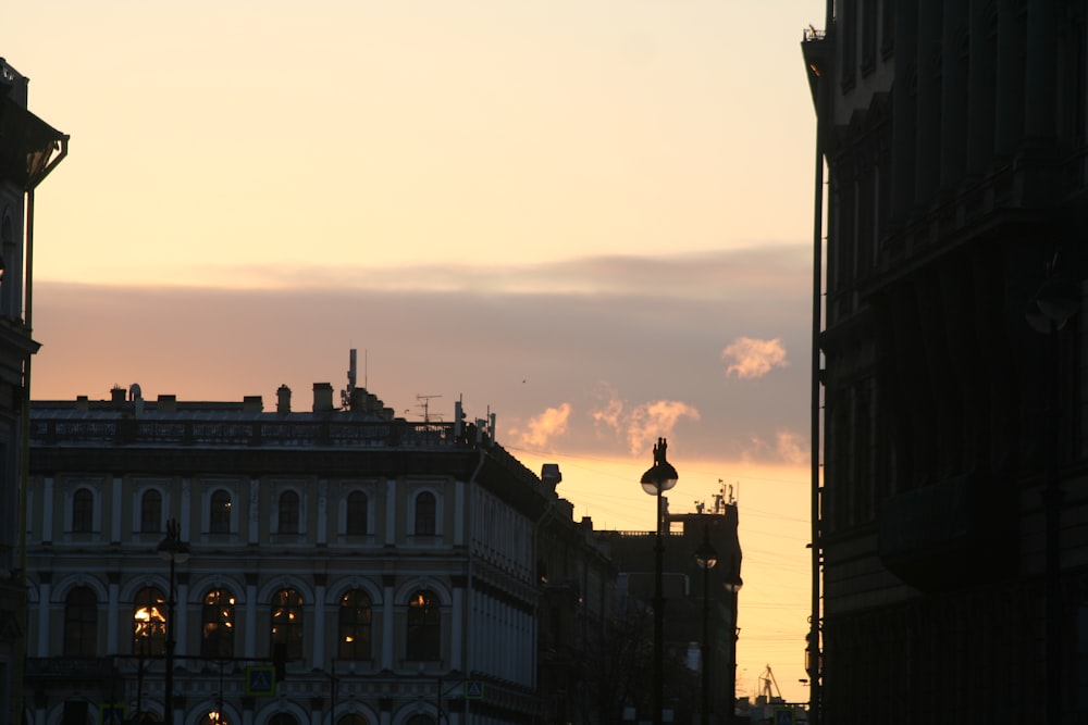 a city street with buildings and a clock tower