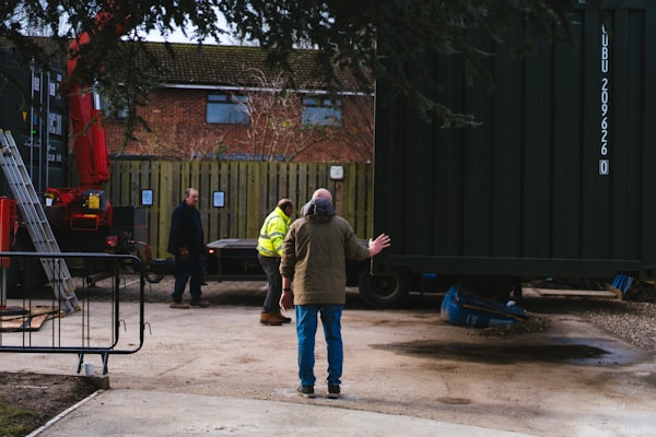 a man standing in front of a train car