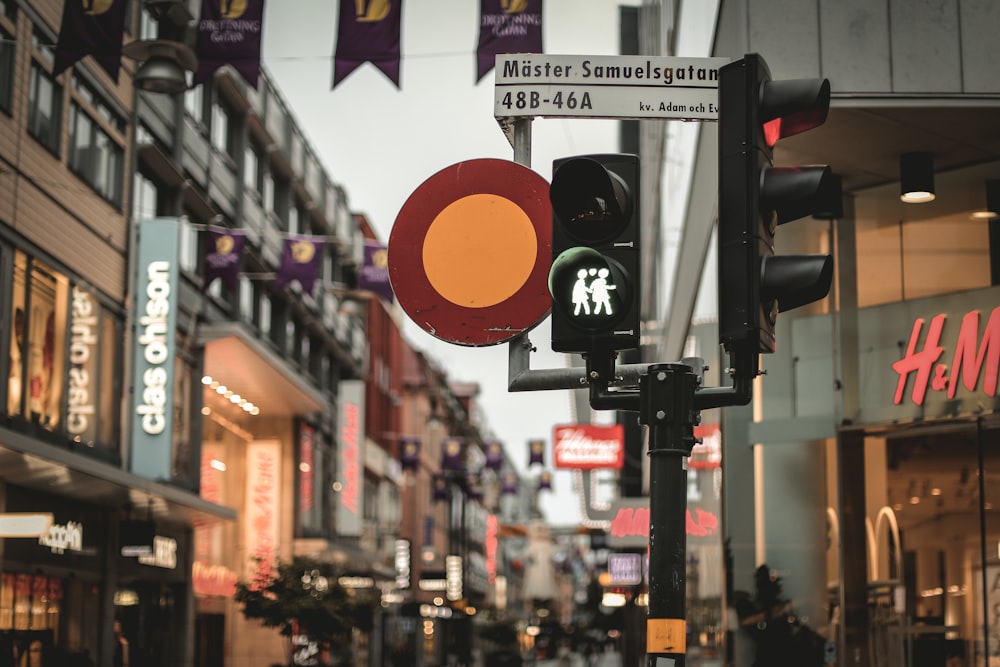 a red traffic light sitting on the side of a road