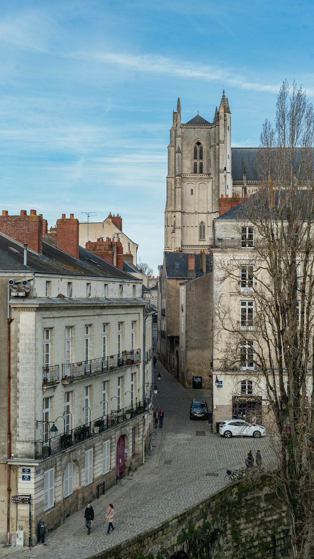 a view of a city street with a church in the background