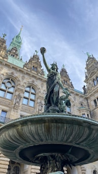 a fountain in front of a large building