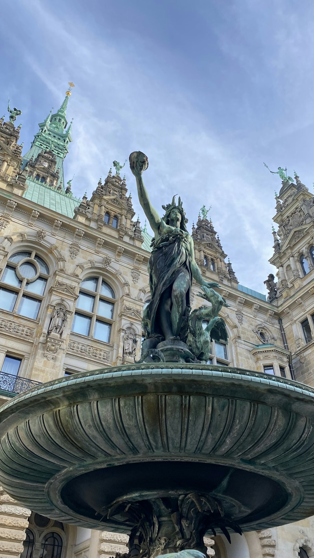 a fountain in front of a large building