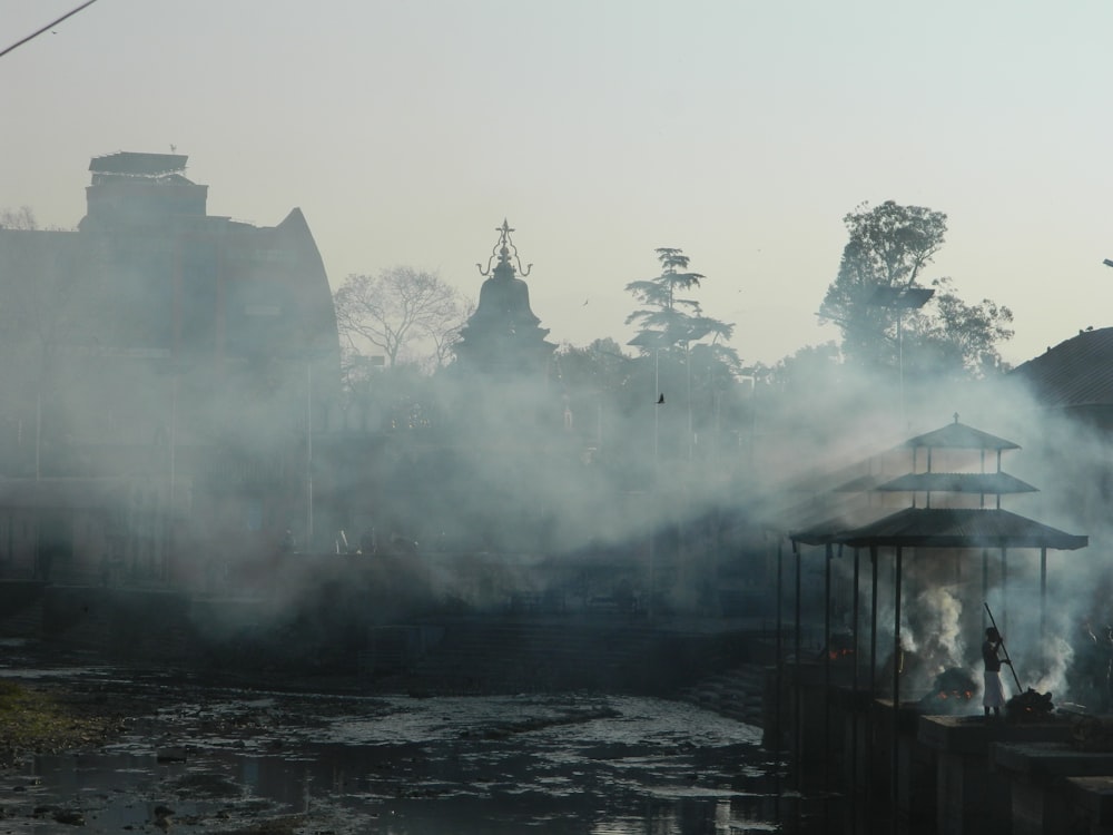 smoke billowing out of the top of a gazebo