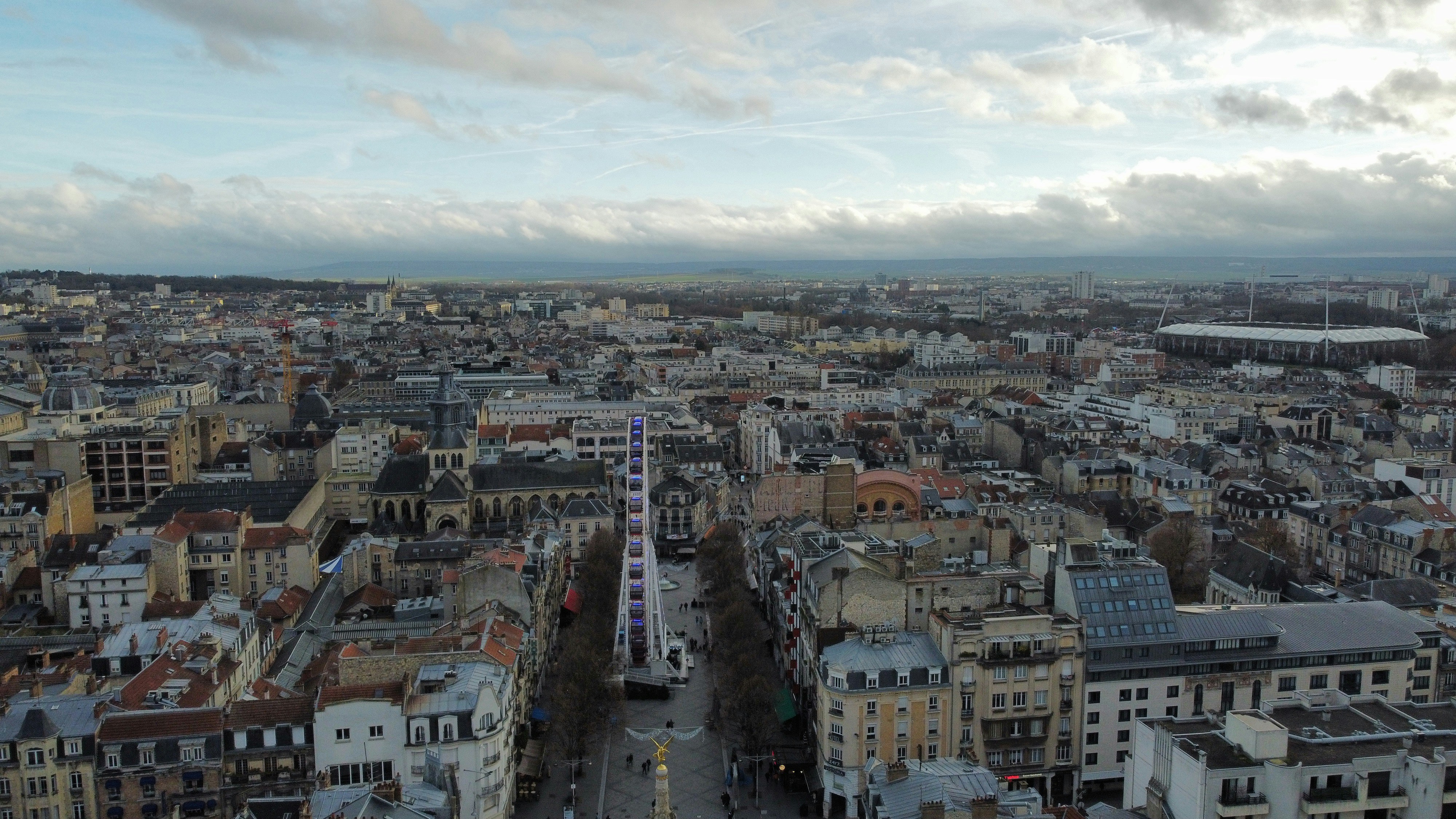 an aerial view of a city with tall buildings, Reims France