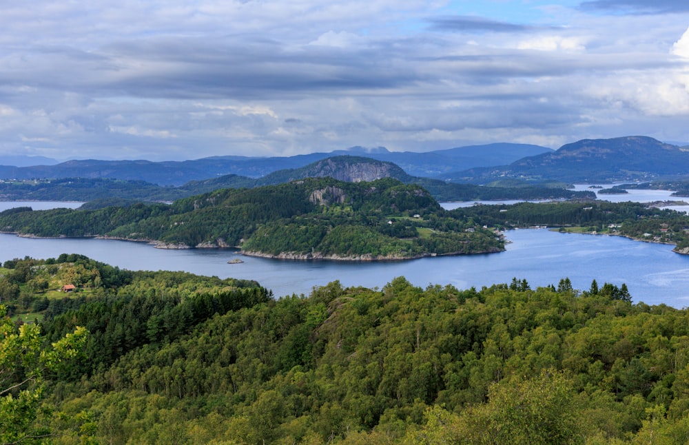 a scenic view of a lake surrounded by mountains