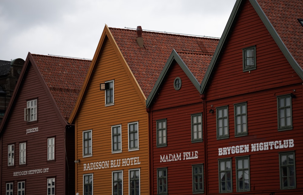 a row of red and yellow wooden houses