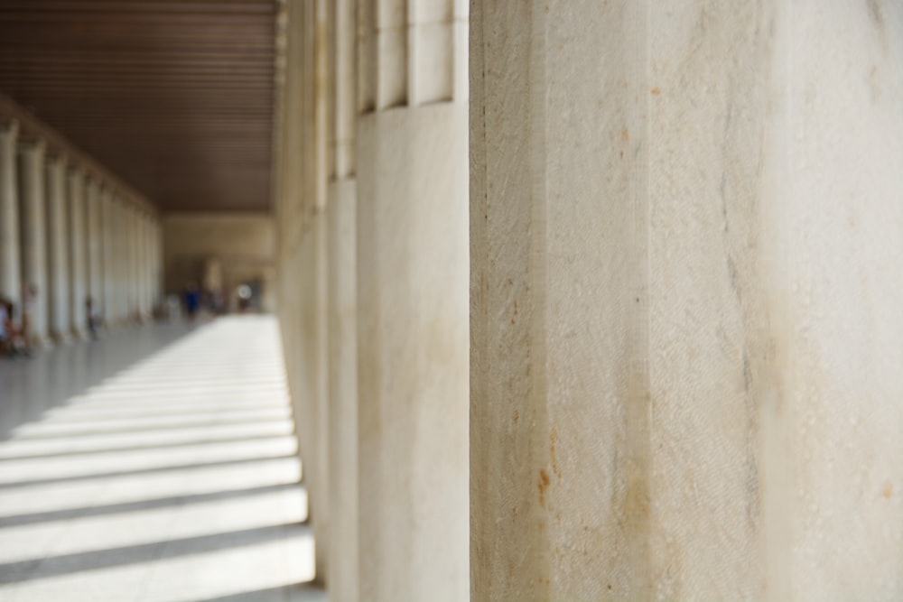 a building with a long line of white columns