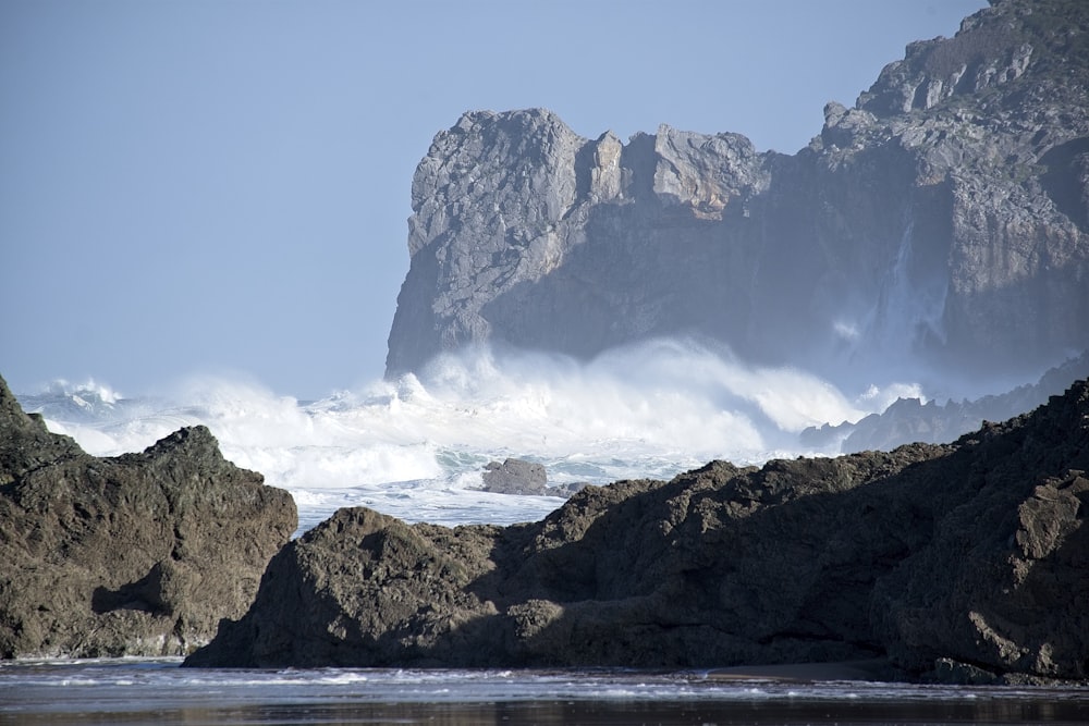 a large body of water surrounded by rocks