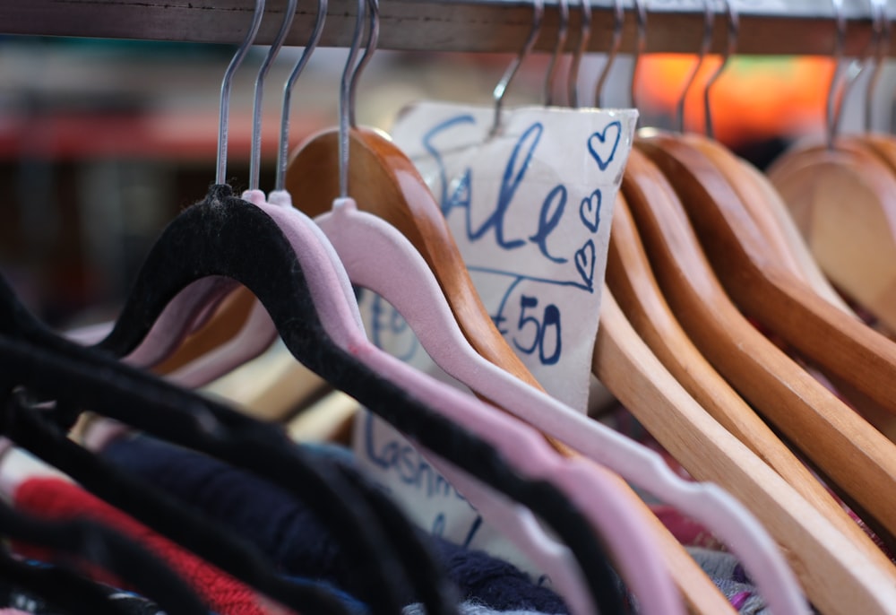 a rack of clothes hanging on clothes pins