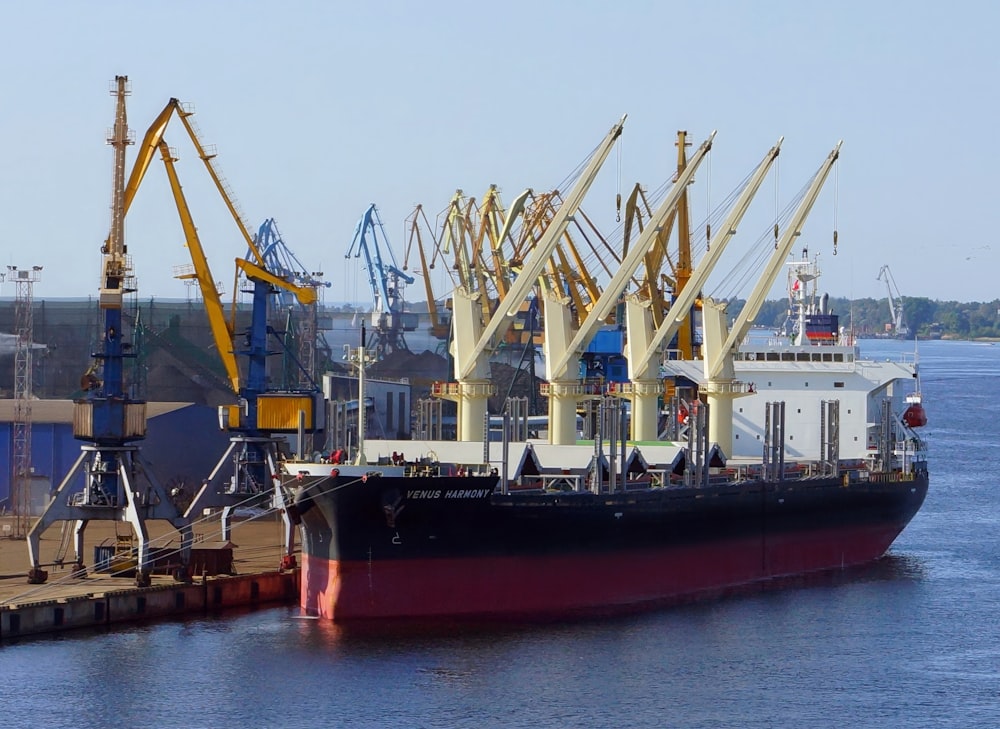 a large cargo ship docked at a dock