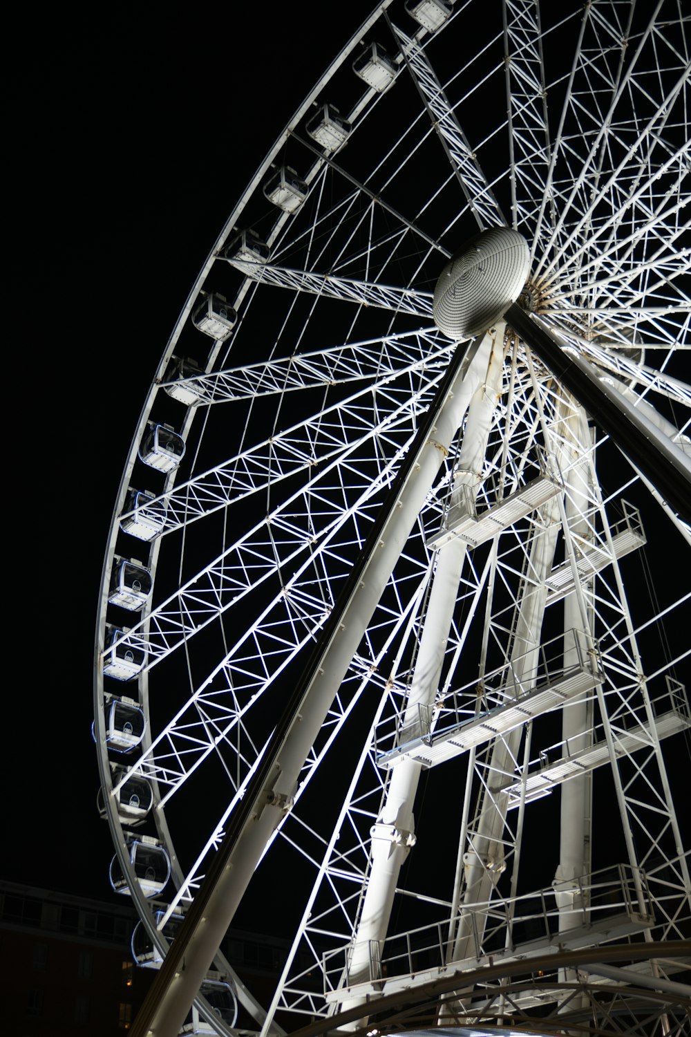 a ferris wheel lit up at night time