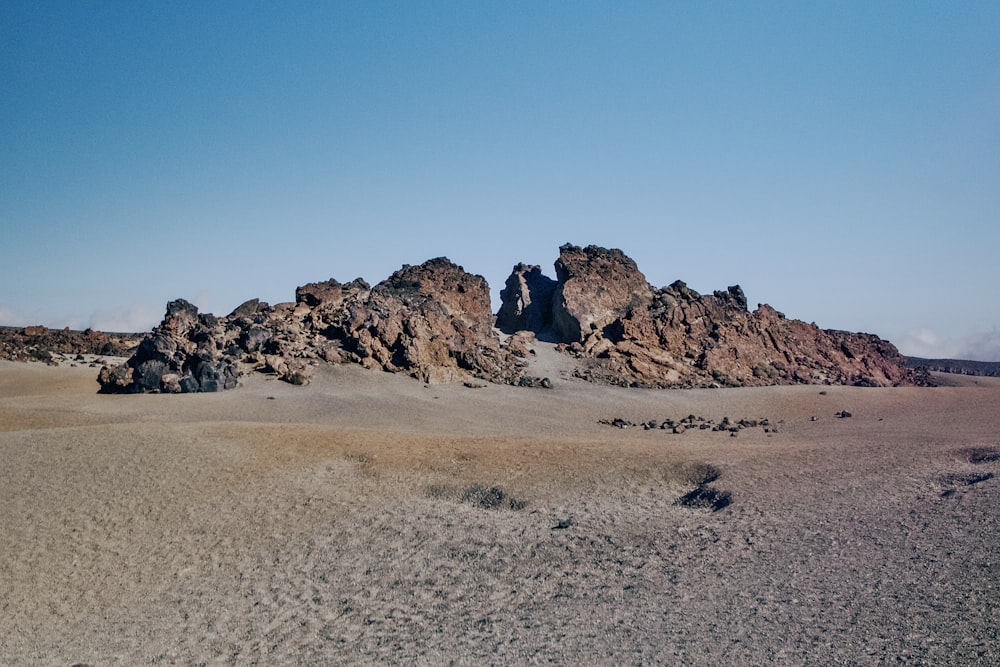 a group of rocks in the middle of a desert