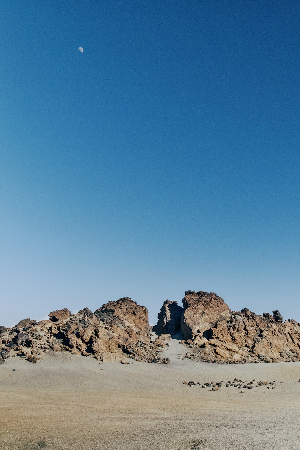 a large rock formation in the middle of a desert