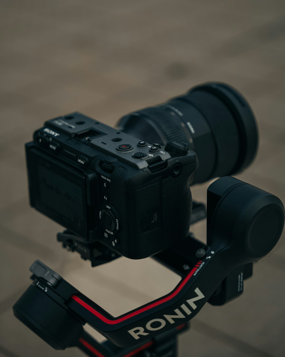 a camera attached to a tripod on a street