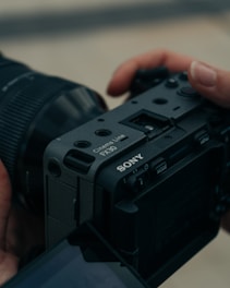 a person holding a camera in their hand