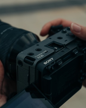 a person holding a camera in their hand