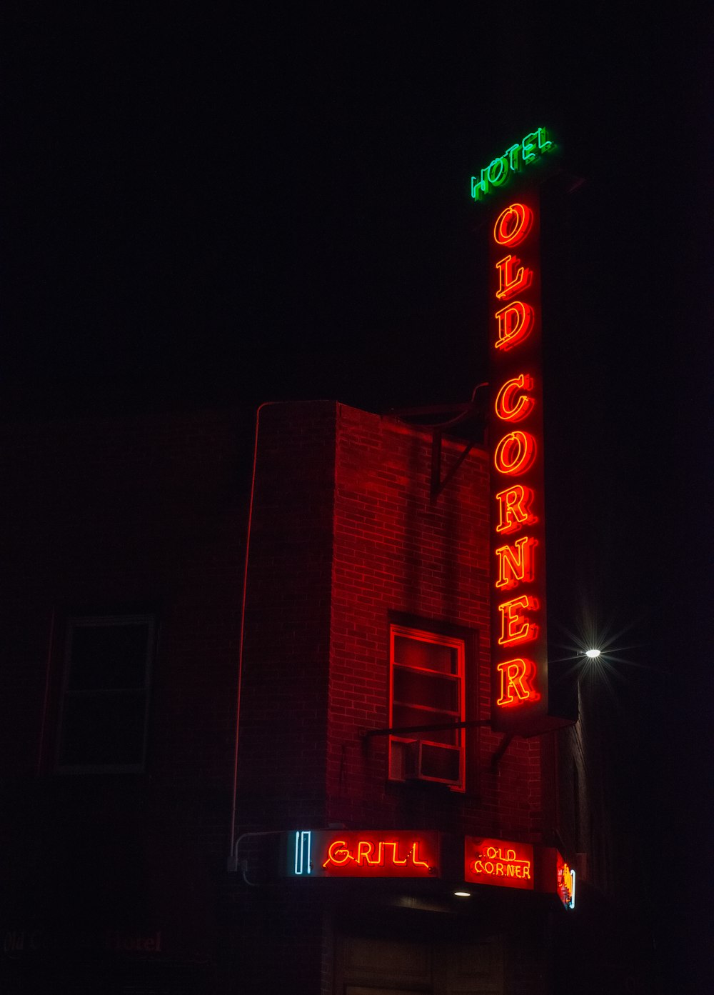 a neon sign on the side of a building