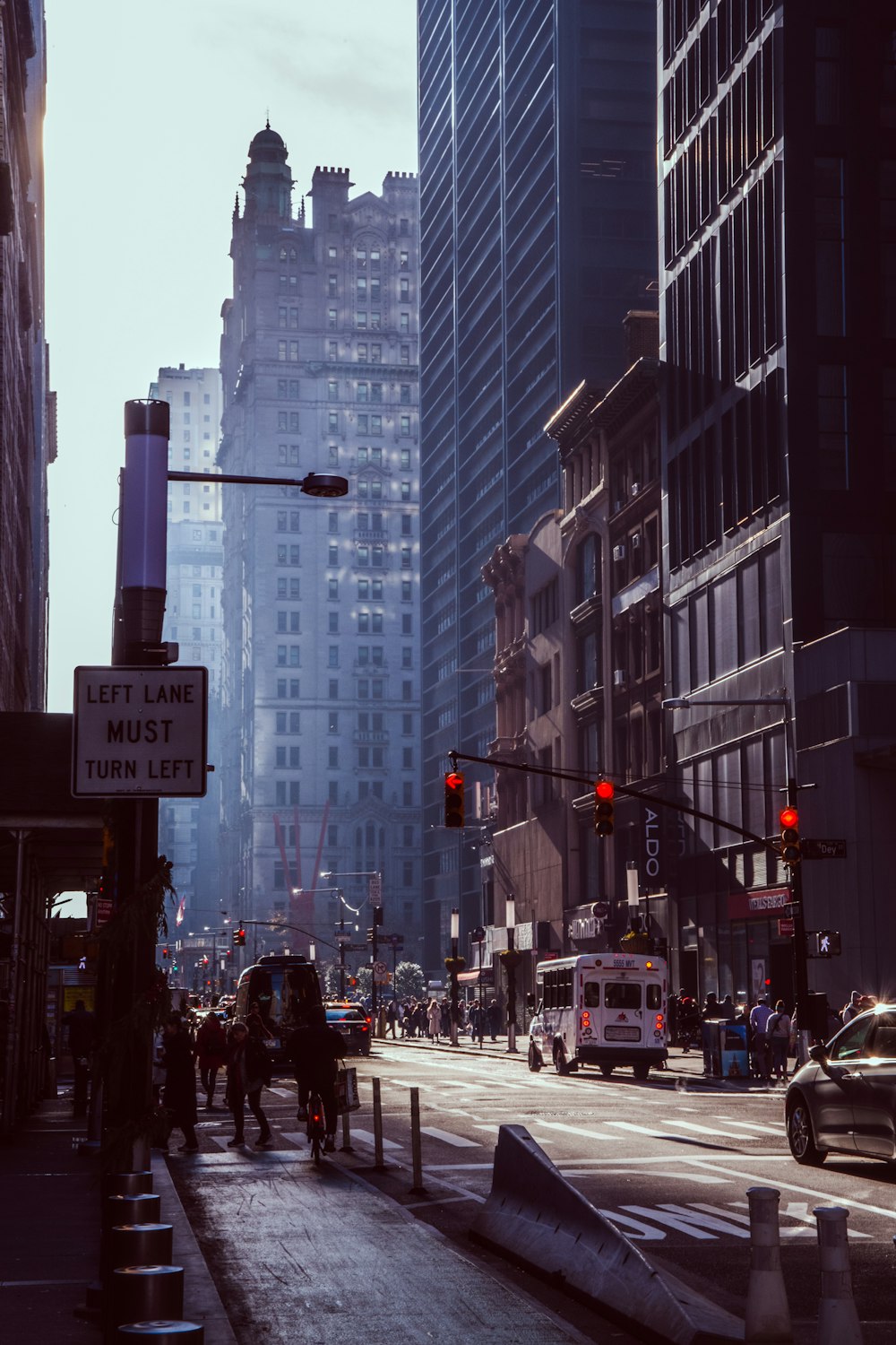 a city street filled with traffic and tall buildings