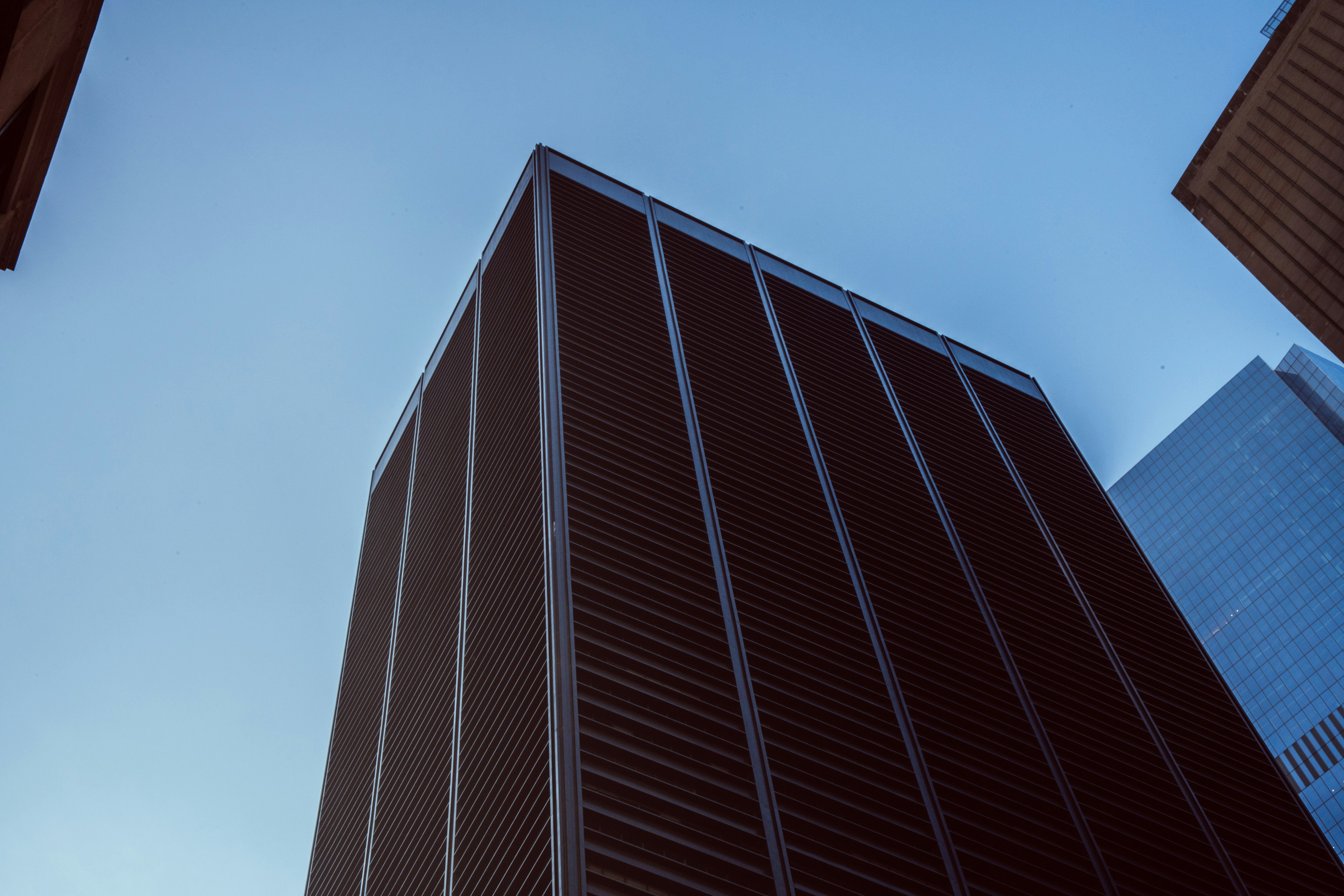 a tall building with a sky background