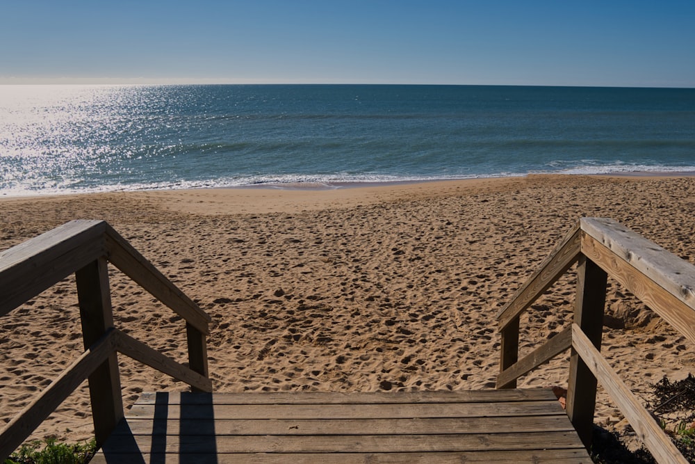 a wooden staircase going down to the beach