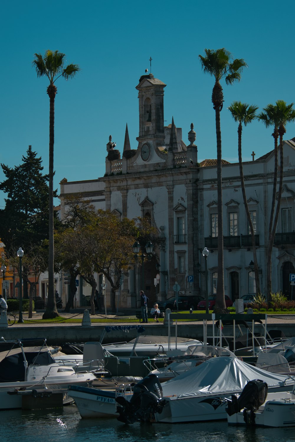 a group of boats sitting in front of a large building