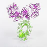 a purple and green string sculpture on a white surface
