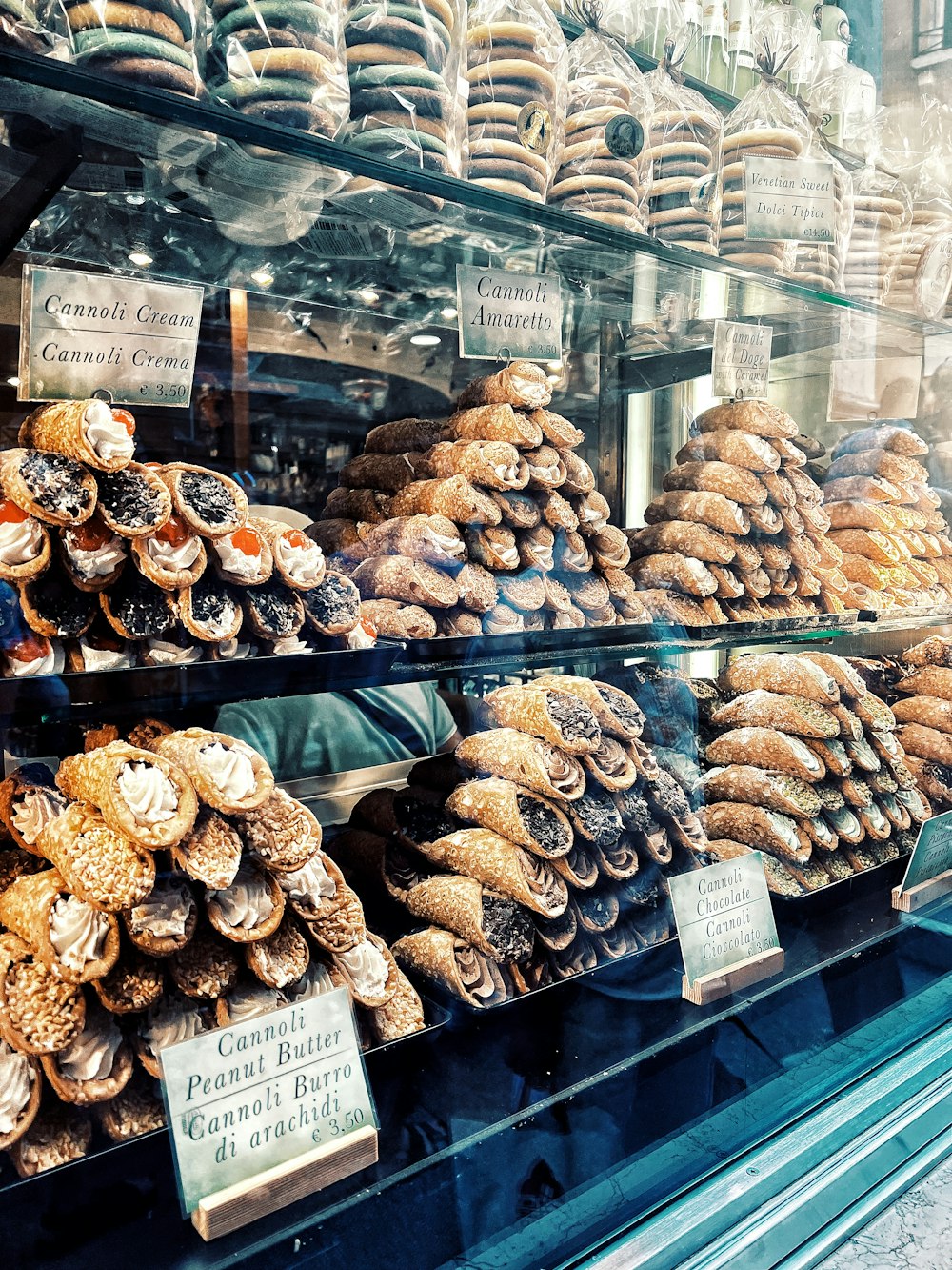 a display case filled with lots of different kinds of pastries