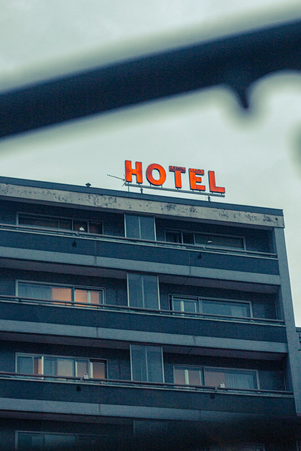 a hotel sign on top of a building