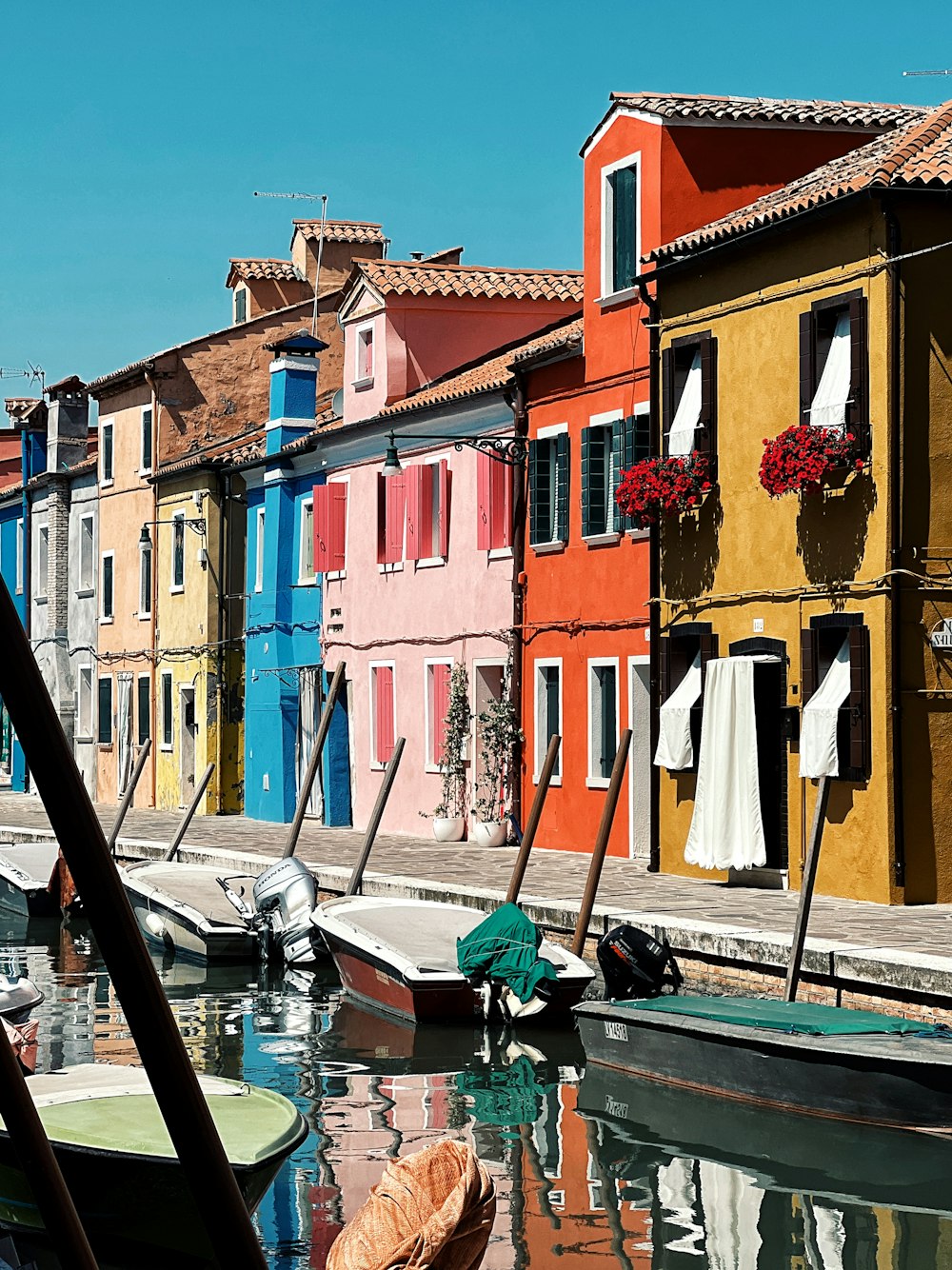 a row of houses next to a body of water