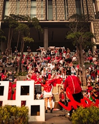 a group of people sitting in front of a building