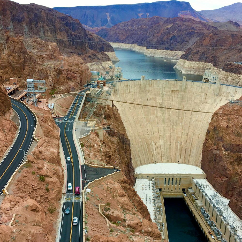 a view of a large dam with a road going through it