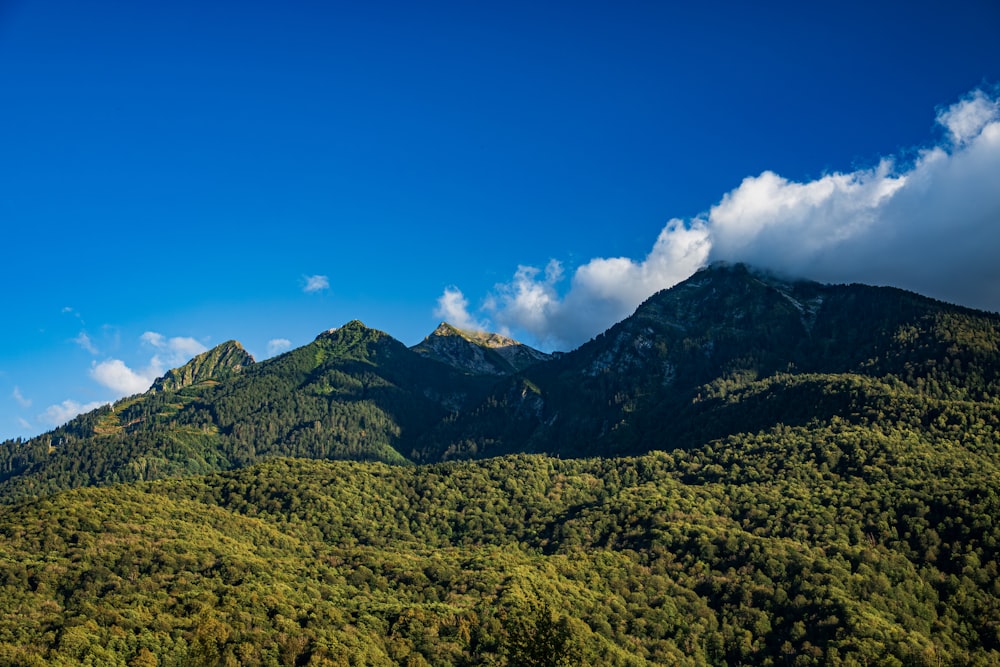 a view of a mountain range with clouds in the sky