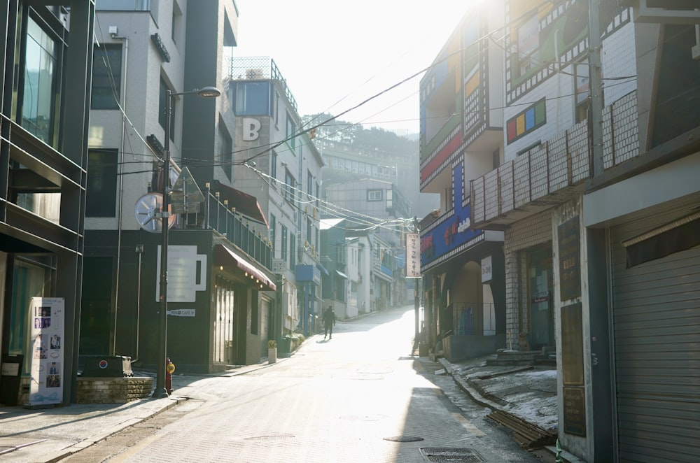 a narrow city street lined with tall buildings