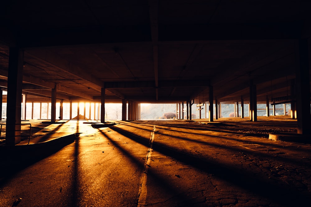 the sun is shining through the windows of an empty building