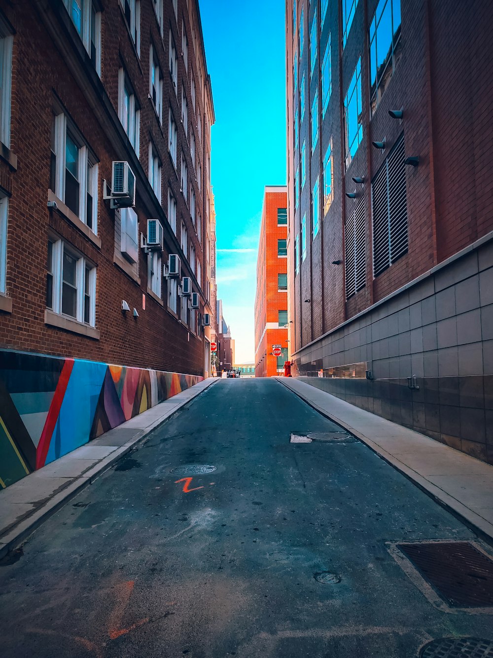 a city street with tall buildings on both sides