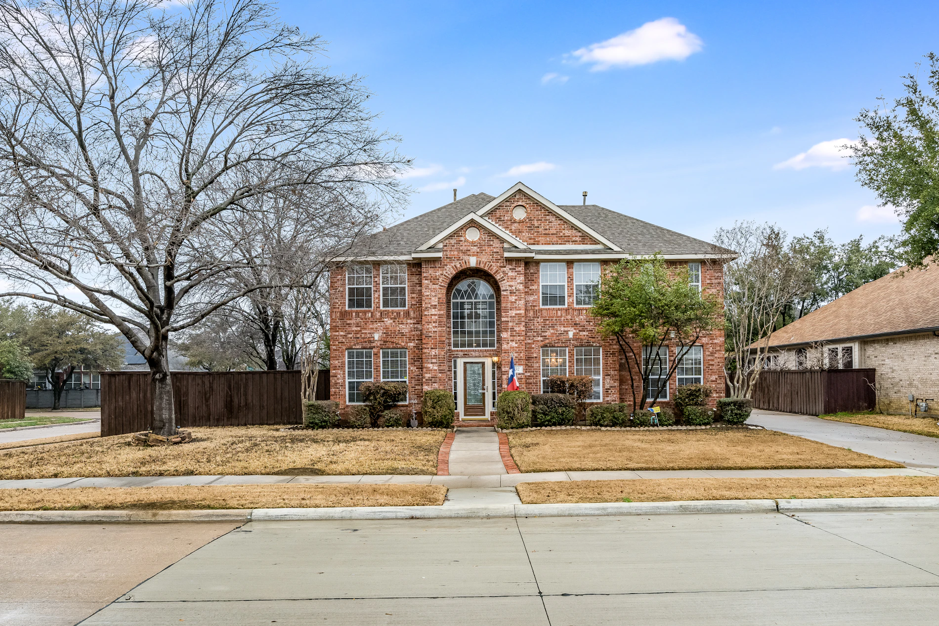 Texas brick house with landscaped front yard