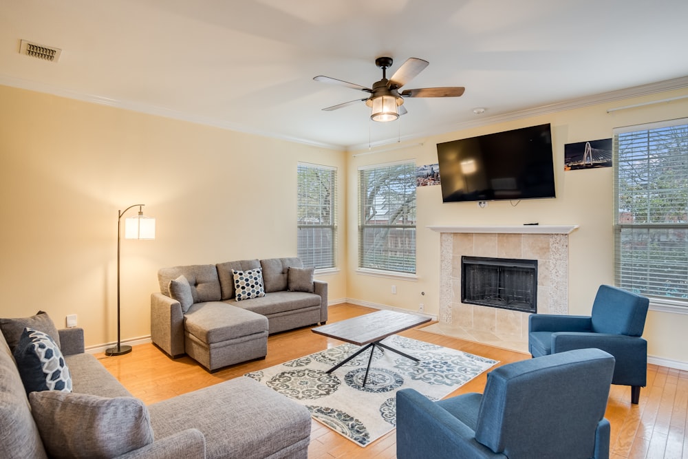 a living room filled with furniture and a flat screen tv