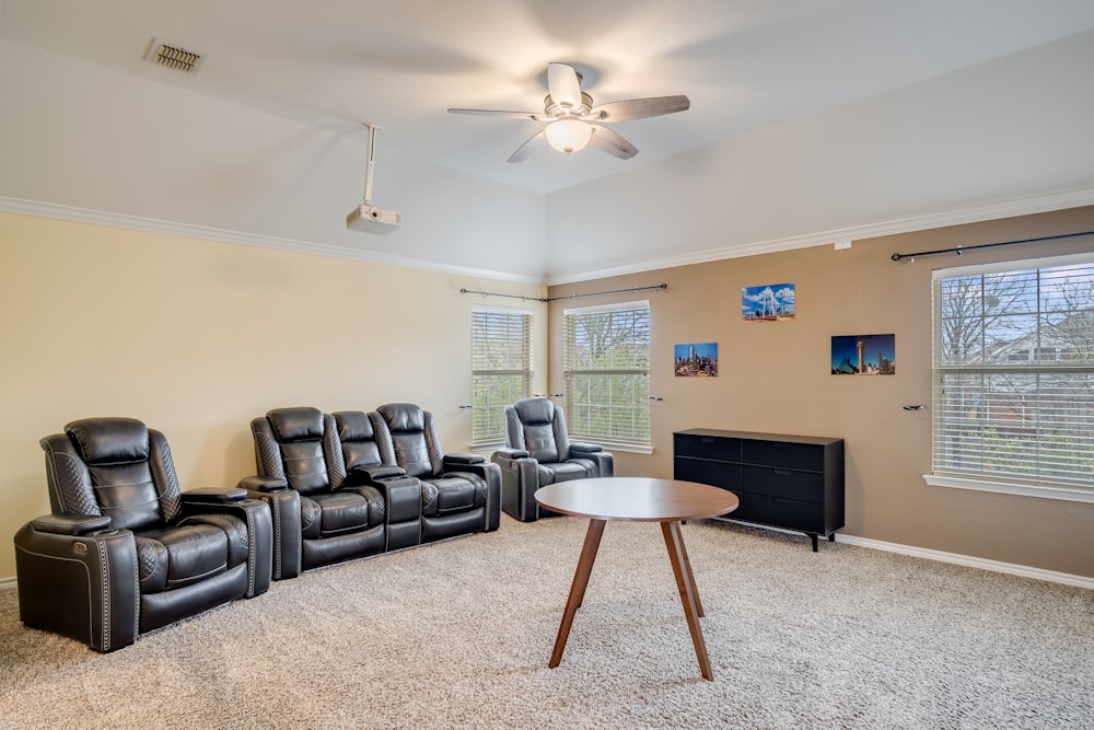 a living room with two recliners and a table