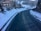 a car is driving down a snowy road